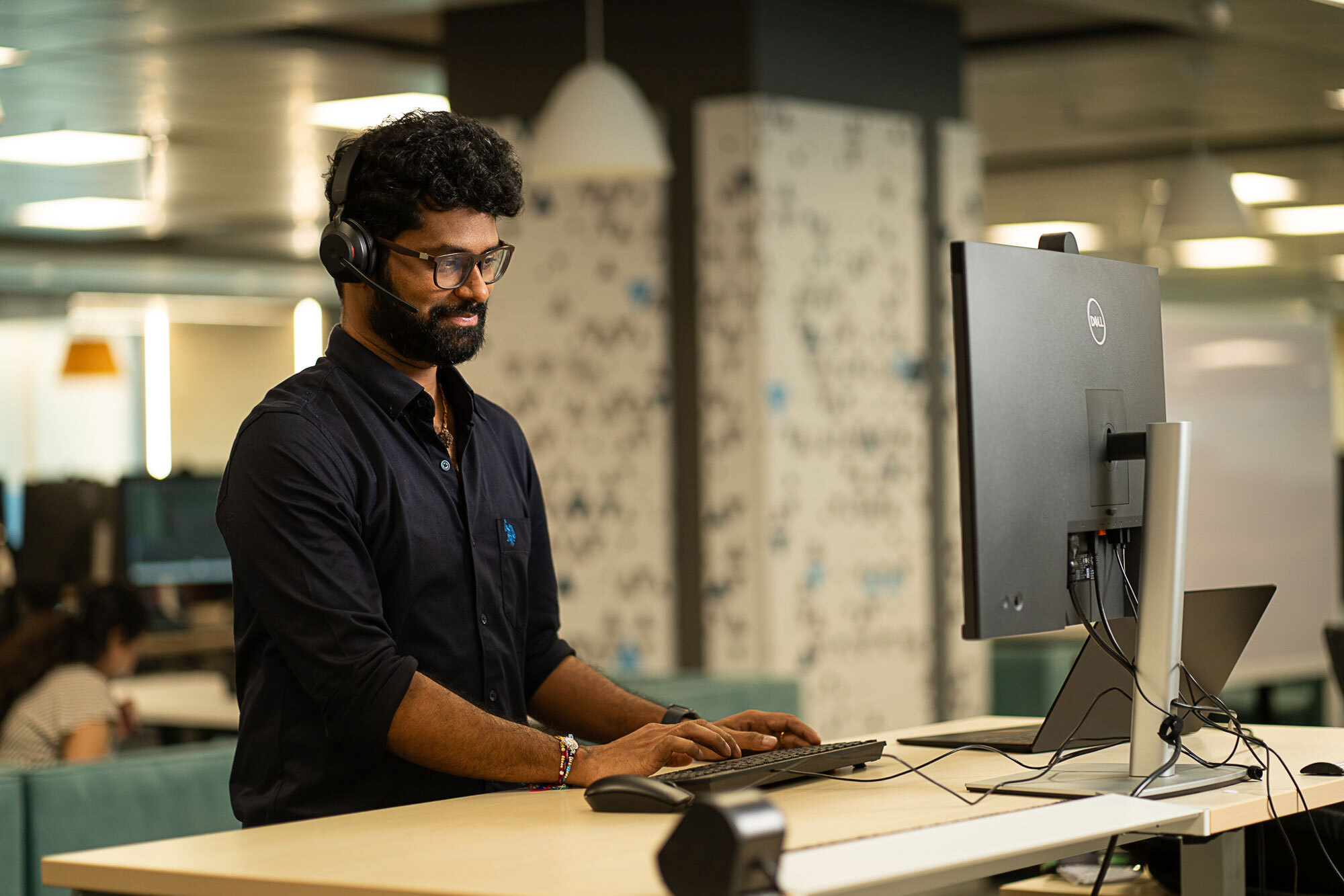 Card image of man working on a laptop